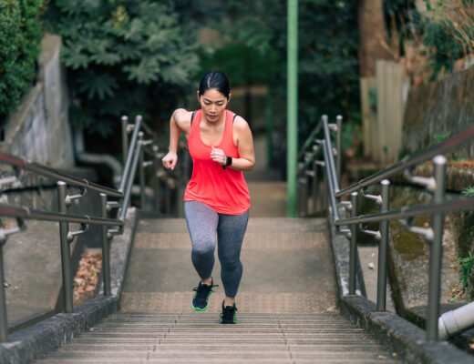 young female running up stairs to get skinny fast